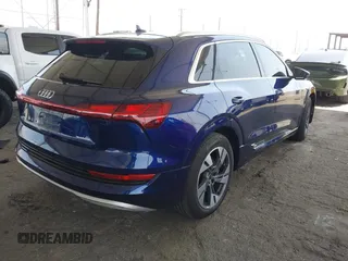 2021 Audi e-tron Premium Plus with VIN WA1LAAGE4MB038563, listed as a IAAI auction lot 42422063 with 31,645 mi miles and . Bid and sale history available at DreamBid. Image 4.