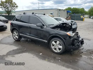 2012 Volkswagen Touareg Sport z VIN WVGEF9BP7CD009824, wystawiony jako Copart lot #58311915 z przebiegiem 154 397 mil mil oraz Szkoda całkowita • Salvage title. Historia ofert i sprzedaży dostępna na DreamBid. Obrazek 4.