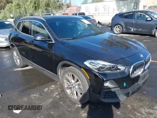 2019 BMW X2 xDrive28i with VIN WBXYJ5C52K5N24828, listed as a IAAI auction lot 41155049 with 59,597 mi miles. Bid and sale history available at carsss.com. Image 1.