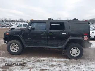2003 Hummer H2 with VIN 5GRGN23UX3H106356, listed as a IAAI auction lot 41185603 with Not Provided miles. Bid and sale history available at carsss.com. Image 14.