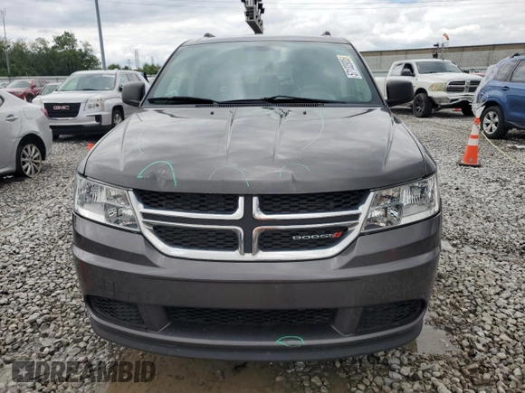 2017 Dodge Journey SE z VIN 3C4PDCAB1HT709104, wystawiony jako Copart lot #57132935 z przebiegiem 89 024 mil mil oraz Szkoda całkowita • Salvage title. Historia ofert i sprzedaży dostępna na DreamBid. Obrazek 5.