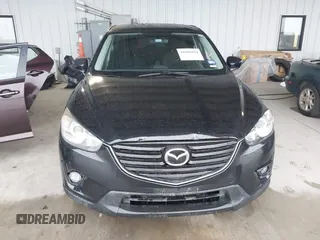 2016 Mazda CX-5 Touring with VIN JM3KE2CY2G0808424, listed as a IAAI auction lot 41880494 with 149,005 mi miles. Bid and sale history available at carsss.com. Image 12.