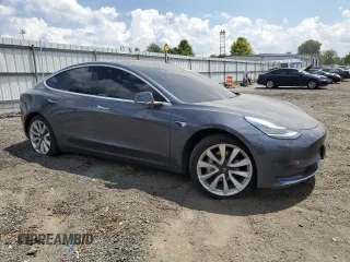 2020 Tesla Model 3 Standard Range Plus with VIN 5YJ3E1EA6LF614045, listed as a Copart auction lot 65222584 with 59,823 mi miles and Salvage Title. Bid and sale history available at DreamBid. Image 4.