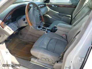 2004 Cadillac DeVille DTS with VIN 1G6KF57904U191266, listed as a Copart auction lot 57869134 with 110,971 mi miles and Salvage Title. Bid and sale history available at carsss.com. Image 7.