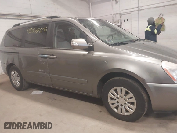 2011 Kia Sedona LX with VIN KNDMG4C78B6363742, listed as a IAAI auction lot 42063426 with 199,828 mi miles. Bid and sale history available at carsss.com. Image 6.