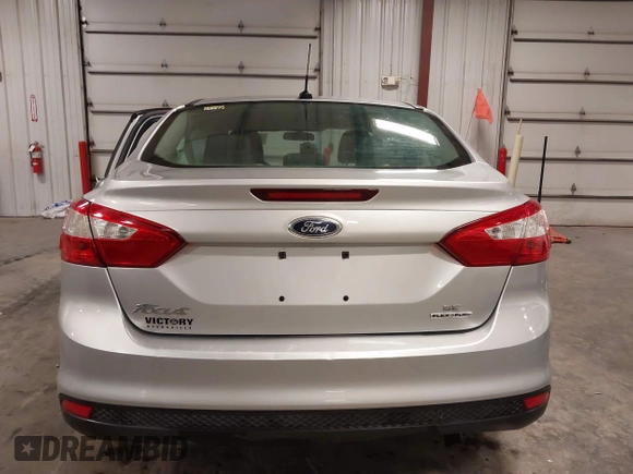 2012 Ford Focus SE z VIN 1FAHP3F21CL463704, wystawiony jako IAAI lot #42246436 z przebiegiem 234 474 mil mil oraz . Historia ofert i sprzedaży dostępna na DreamBid. Obrazek 17.