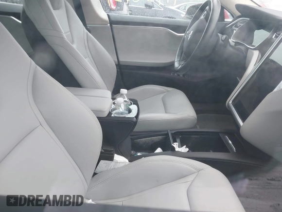 2016 Tesla Model S 90D with VIN 5YJSA1E28GF150889, listed as a IAAI auction lot 41958931 with 24,090 mi miles and . Bid and sale history available at DreamBid. Image 5.