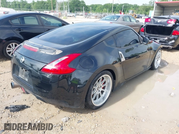 2013 Nissan 370Z with VIN JN1AZ4EH9DM880407, listed as a IAAI auction lot 42078526 with 216,029 mi miles. Bid and sale history available at carsss.com. Image 4.