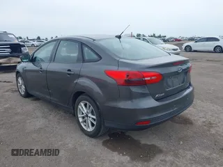 2017 Ford Focus SE z VIN 1FADP3F21HL205009, wystawiony jako IAAI lot #42305641 z przebiegiem 75 160 mil mil oraz . Historia ofert i sprzedaży dostępna na DreamBid. Obrazek 3.