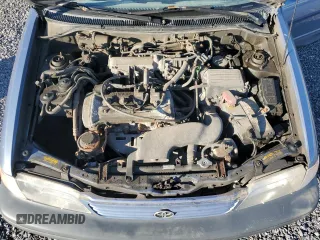 1999 Toyota Tercel z VIN JT2BC53L9X0354072, wystawiony jako Copart lot #73050384 z przebiegiem 163 566 mil mil oraz Szkody całkowita. Historia ofert i sprzedaży dostępna na DreamBid. Obrazek 11.
