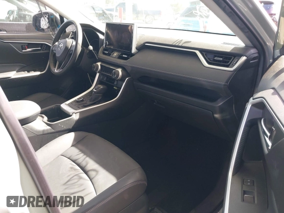 2023 Toyota RAV4 Hybrid XLE Premium with VIN JTMB6RFV8PD086983, listed as a IAAI auction lot 41612674 with 70,817 mi miles. Bid and sale history available at carsss.com. Image 5.