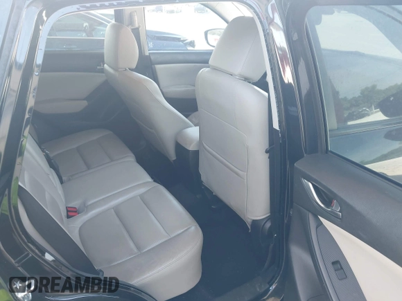 2015 Mazda CX-5 Grand Touring with VIN JM3KE4DY7F0481883, listed as a IAAI auction lot 42091709 with 184,248 mi miles and . Bid and sale history available at DreamBid. Image 8.