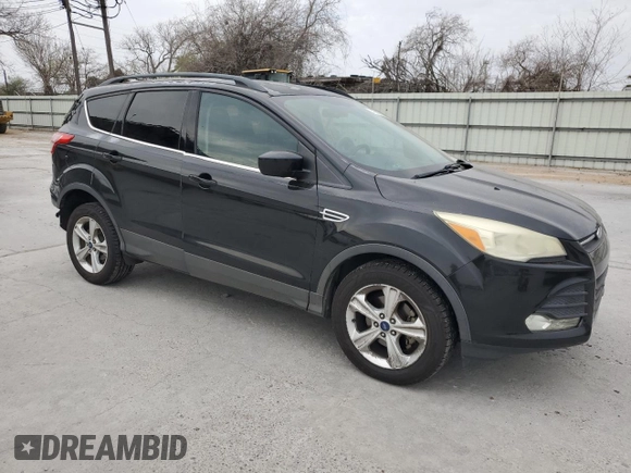 2014 Ford Escape SE with VIN 1FMCU0GX8EUB08186, listed as a Copart auction lot 48189035 with 128,483 mi miles and Salvage Title. Bid and sale history available at carsss.com. Image 4.