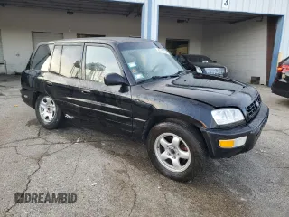 1999 Toyota RAV4 with VIN JT3GP10V9X7042801, listed as a Copart auction lot 82712874 with 256,151 mi miles and Salvage Title. Bid and sale history available at DreamBid. Image 4.