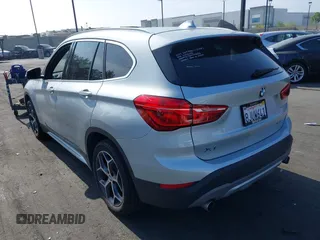 2019 BMW X1 xDrive28i with VIN WBXHT3C56K5L38658, listed as a IAAI auction lot 42496734 with 49,373 mi miles and . Bid and sale history available at DreamBid. Image 3.