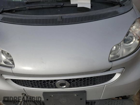 2015 Smart fortwo Passion с VIN WMEEJ9AA1FK831357, выставлен на аукционе Copart как лот 87001564 с пробегом Не указан миль и Списание • Salvage title. История ставок и продаж доступна на DreamBid. Изображение 12.