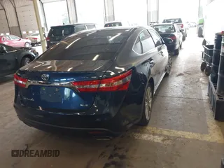 2014 Toyota Avalon Limited with VIN 4T1BK1EB1EU128987, listed as a IAAI auction lot 42034677 with 104,153 mi miles and . Bid and sale history available at DreamBid. Image 4.