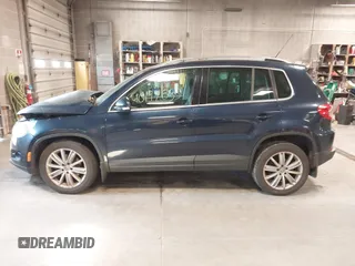 2011 Volkswagen Tiguan SE with VIN WVGBV7AXXBW533872, listed as a IAAI auction lot 40197835 with 104,685 mi miles and . Bid and sale history available at DreamBid. Image 14.