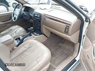 2000 Jeep Grand Cherokee Laredo z VIN 1J4GW48S2YC390226, wystawiony jako IAAI lot #42326715 z przebiegiem 273 806 mil mil oraz . Historia ofert i sprzedaży dostępna na DreamBid. Obrazek 5.