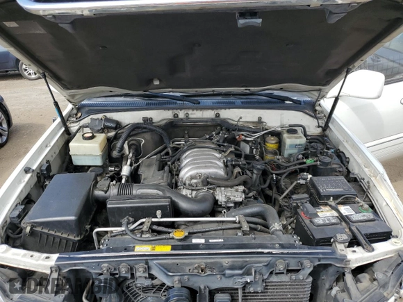 2002 Lexus LX 470 z VIN JTJHT00W423522126, wystawiony jako Copart lot #56582855 z przebiegiem 280 679 mil mil oraz Szkoda całkowita • Salvage title. Historia ofert i sprzedaży dostępna na DreamBid. Obrazek 12.