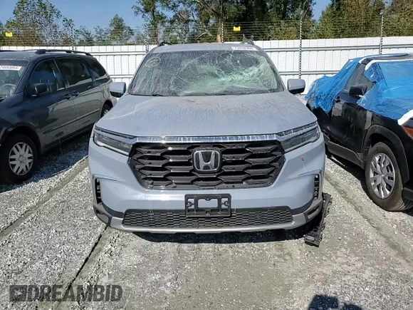 2024 Honda Pilot Touring with VIN 5FNYG2H70RB015463, listed as a Copart auction lot 73832964 with 14,606 mi miles and Salvage title. Bid and sale history available at DreamBid. Image 11.