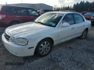 2005 Kia Optima LX z VIN KNAGD128X55408900, wystawiony jako Copart lot #80800554 z przebiegiem 63 125 mil mil oraz Szkoda całkowita • Salvage title. Historia ofert i sprzedaży dostępna na DreamBid. Obrazek 1.