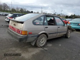 1986 Toyota Corolla с VIN JT2AE83L6G3356299, выставлен на аукционе Copart как лот 83918494 с пробегом 479 909 миль миль и Списание • Salvage title. История ставок и продаж доступна на DreamBid. Изображение 3.