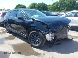 2023 Mazda CX-9 Touring with VIN JM3TCBCY2P0651679, listed as a IAAI auction lot 42002920 with 67,791 mi miles and . Bid and sale history available at DreamBid. Image 1.