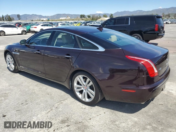 2014 Jaguar XJ with VIN SAJWA1CZ3E8V69877, listed as a Copart auction lot 51520405 with 57,567 mi miles and Clean Title. Bid and sale history available at DreamBid. Image 2.