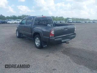 2014 Toyota Tacoma with VIN 5TFLU4EN9EX099414, listed as a IAAI auction lot 40528514 with 122,827 mi miles. Bid and sale history available at carsss.com. Image 3.