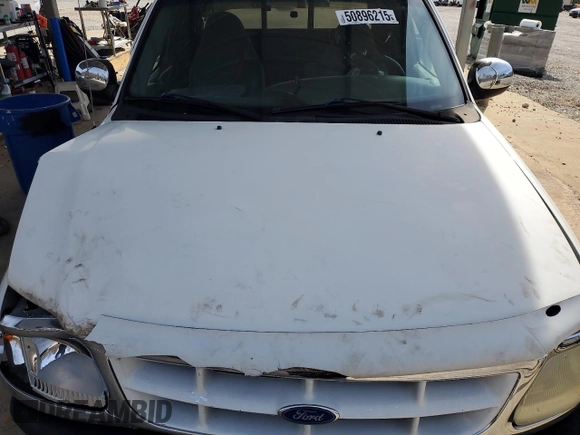 1997 Ford F-150 z VIN 1FTDX0766VKA86983, wystawiony jako Copart lot #50896215 z przebiegiem 214 746 mil mil oraz Szkoda całkowita • Salvage title. Historia ofert i sprzedaży dostępna na DreamBid. Obrazek 11.