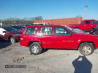1998 Jeep Grand Cherokee Laredo with VIN 1J4GZ48Y6WC290798, listed as a IAAI auction lot 41816161 with 299,875 mi miles. Bid and sale history available at carsss.com. Image 13.