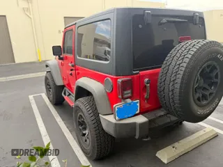 2015 Jeep Wrangler Sport with VIN 1C4AJWAG0FL750098, listed as a IAAI auction lot 41266454 with 77,115 mi miles. Bid and sale history available at carsss.com. Image 3.