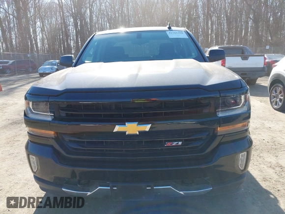 2018 Chevrolet Silverado 1500 LT with VIN 1GCUKREC3JF119906, listed as a IAAI auction lot 41765398 with 122,472 mi miles and . Bid and sale history available at DreamBid. Image 12.