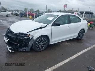 2016 Volkswagen Jetta Sedan 1.8T Sport with VIN 3VWD17AJ3GM404199, listed as a IAAI auction lot 41934993 with 43,183 mi miles. Bid and sale history available at carsss.com. Image 2.