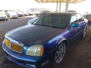 2003 Cadillac DeVille DTS z VIN 1G6KF57943U114611, wystawiony jako IAAI lot #41661350 z przebiegiem 160 762 mil mil oraz . Historia ofert i sprzedaży dostępna na DreamBid. Obrazek 2.