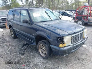 1999 Mercury Mountaineer z VIN 4M2DU52P3XUJ37055, wystawiony jako IAAI lot #41940577 z przebiegiem 218 702 mil mil oraz . Historia ofert i sprzedaży dostępna na DreamBid. Obrazek 1.