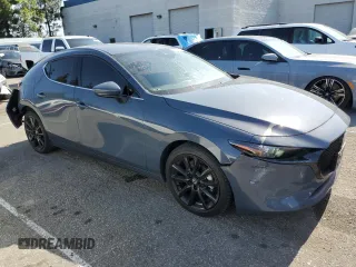 2022 Mazda 3 Premium with VIN JM1BPAML8N1511424, listed as a Copart auction lot 57108135 with 52,791 mi miles and Salvage title. Bid and sale history available at DreamBid. Image 4.