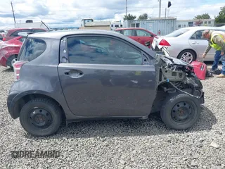 2012 Scion iQ with VIN JTNJJXB00CJ018659, listed as a IAAI auction lot 42232715 with 142,516 mi miles and . Bid and sale history available at DreamBid. Image 14.