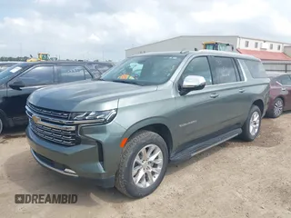 2023 Chevrolet Suburban Premier with VIN 1GNSCFKD6PR393843, listed as a IAAI auction lot 42101935 with 59,604 mi miles. Bid and sale history available at carsss.com. Image 2.