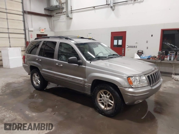 1999 Jeep Grand Cherokee Limited with VIN 1J4GW68N7XC752314, listed as a IAAI auction lot 41776905 with 228,023 mi miles. Bid and sale history available at carsss.com. Image 1.