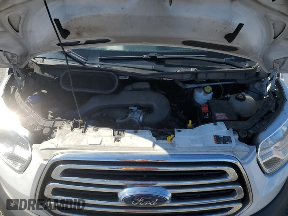 2019 Ford Transit z VIN 1FTYR1ZM9KKB51799, wystawiony jako Copart lot #48765045 z przebiegiem 261 954 mil mil oraz Szkoda całkowita • Salvage title. Historia ofert i sprzedaży dostępna na DreamBid. Obrazek 13.