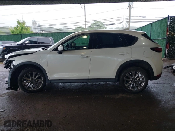 2019 Mazda CX-5 Grand Touring with VIN JM3KFBDMXK0648813, listed as a IAAI auction lot 42524680 with 23,521 mi miles and . Bid and sale history available at DreamBid. Image 15.