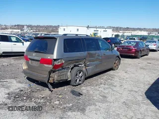 2010 Honda Odyssey Touring with VIN 5FNRL3H9XAB094765, listed as a IAAI auction lot 41892743 with 127,143 mi miles. Bid and sale history available at carsss.com. Image 4.