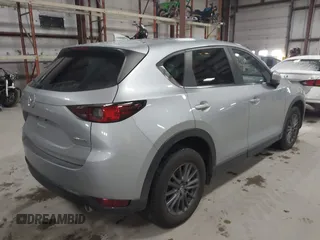 2020 Mazda CX-5 Touring with VIN JM3KFBCMXL0784653, listed as a IAAI auction lot 41817904 with 71,513 mi miles and . Bid and sale history available at carsss.com. Image 4.