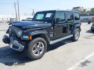 2020 Jeep Wrangler Unlimited Sahara with VIN 1C4HJXEN6LW235159, listed as a IAAI auction lot 42045083 with 68,400 mi miles and . Bid and sale history available at DreamBid. Image 2.