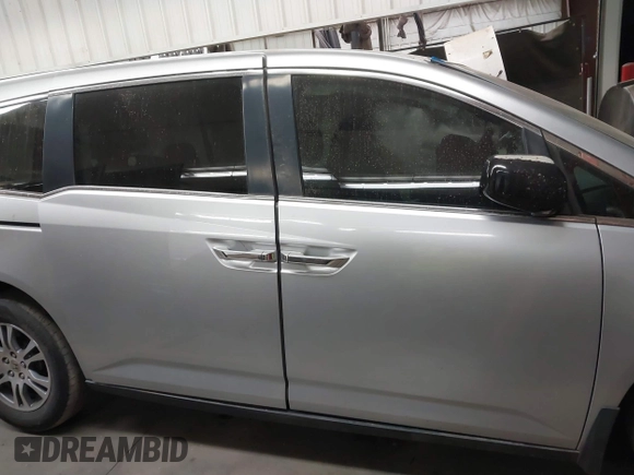 2011 Honda Odyssey EX-L with VIN 5FNRL5H62BB083682, listed as a IAAI auction lot 41425267 with 169,166 mi miles and . Bid and sale history available at carsss.com. Image 12.