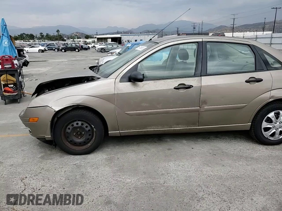 2005 Ford Focus S with VIN 1FAFP34N55W105530, listed as a Copart auction lot 59186695 with 136,204 mi miles and Salvage title. Bid and sale history available at DreamBid. Image 13.