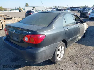 2003 Toyota Corolla CE with VIN 1NXBR32E43Z047677, listed as a IAAI auction lot 41427393 with 299,999 mi miles. Bid and sale history available at carsss.com. Image 4.