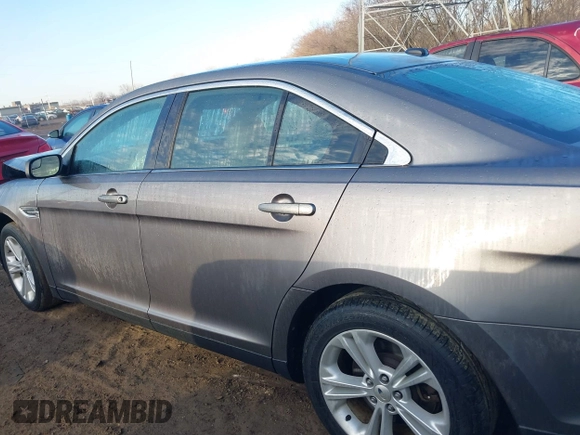 2013 Ford Taurus SEL z VIN 1FAHP2E84DG193376, wystawiony jako IAAI lot #41661721 z przebiegiem 136 341 mil mil oraz . Historia ofert i sprzedaży dostępna na DreamBid. Obrazek 14.